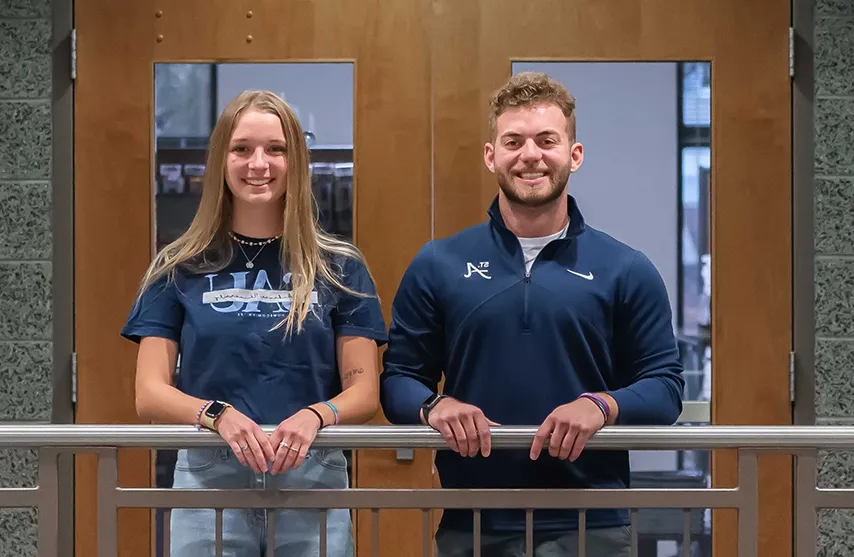 Jack Day and Norah Perkins smile at the camera.